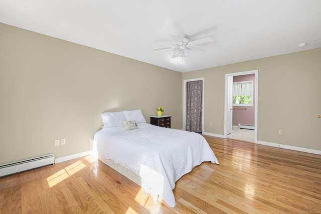 58 Snake Meadow Rd, Killingly, CT 06239 - bedroom with a baseboard heating unit, baseboard heating, wood finished floors, and baseboards
