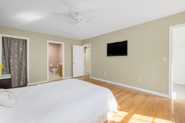 58 Snake Meadow Rd, Killingly, CT 06239 - bedroom featuring wood finished floors, baseboards, connected bathroom, a spacious closet, and ceiling fan