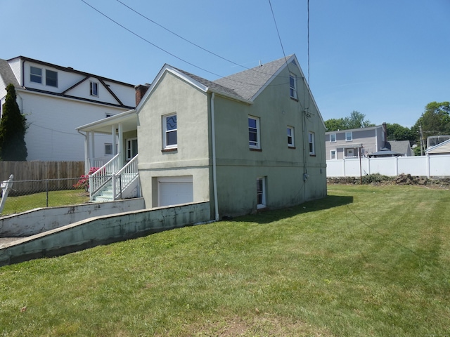 450 Thorme St, Bridgeport, CT 06606 - view of side of property with stucco siding and a shingled roof