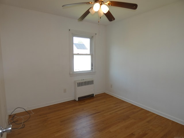 450 Thorme St, Bridgeport, CT 06606 - unfurnished room featuring radiator heating unit, light wood finished floors, and baseboards
