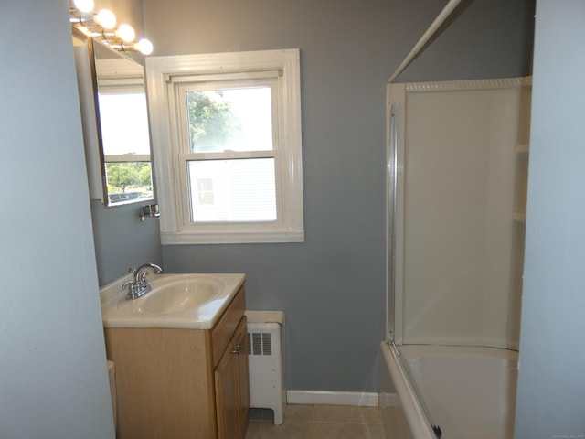 450 Thorme St, Bridgeport, CT 06606 - bathroom with vanity, baseboards, radiator, tile patterned floors, and washtub / shower combination