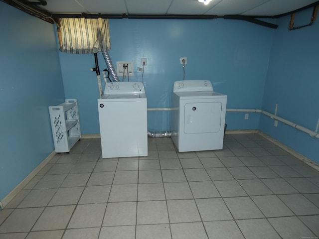 450 Thorme St, Bridgeport, CT 06606 - laundry area with washing machine and dryer, baseboards, and tile patterned flooring