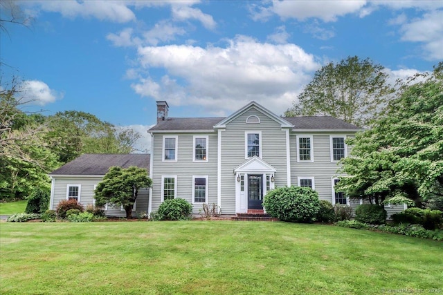 11 Wendover Rd, Newtown, CT 06470 - colonial inspired home featuring a chimney, a front yard, and roof with shingles