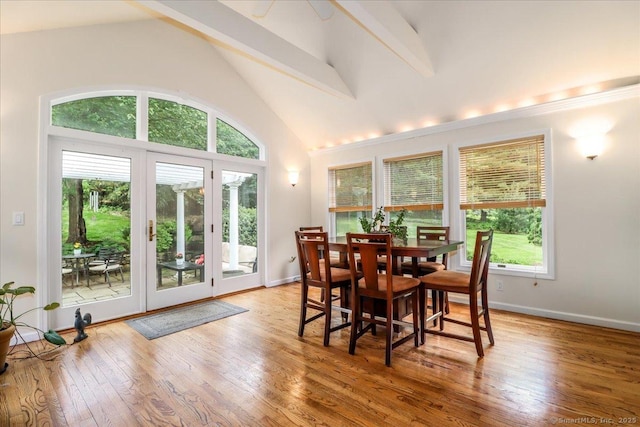 11 Wendover Rd, Newtown, CT 06470 - dining area with light wood finished floors, beam ceiling, high vaulted ceiling, and baseboards