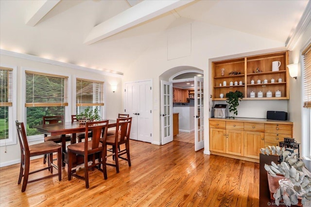 11 Wendover Rd, Newtown, CT 06470 - dining area with arched walkways, high vaulted ceiling, plenty of natural light, light wood-style flooring, and beam ceiling