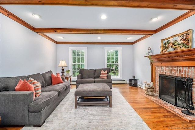 11 Wendover Rd, Newtown, CT 06470 - living area featuring wood finished floors, beamed ceiling, ornamental molding, baseboard heating, and a brick fireplace