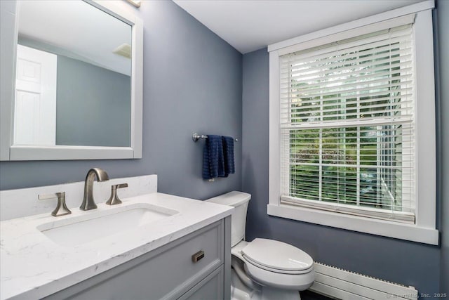11 Wendover Rd, Newtown, CT 06470 - bathroom featuring baseboard heating, toilet, and vanity