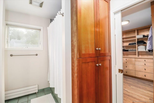 11 Wendover Rd, Newtown, CT 06470 - full bath with a baseboard radiator, a closet, curtained shower, and wood finished floors