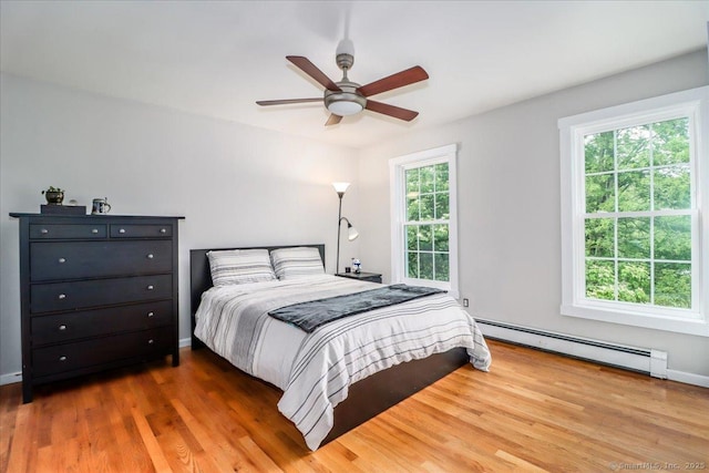 11 Wendover Rd, Newtown, CT 06470 - bedroom with a baseboard radiator, wood finished floors, ceiling fan, and baseboards