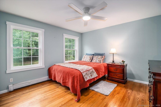 11 Wendover Rd, Newtown, CT 06470 - bedroom featuring baseboard heating, wood finished floors, baseboards, and ceiling fan
