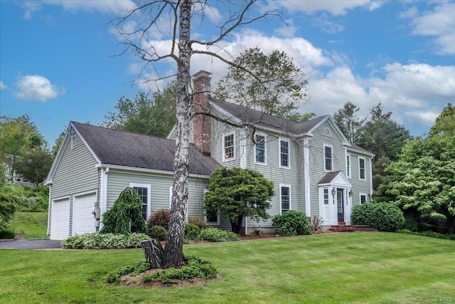 11 Wendover Rd, Newtown, CT 06470 - colonial-style house featuring a chimney, a front yard, asphalt driveway, and an attached garage
