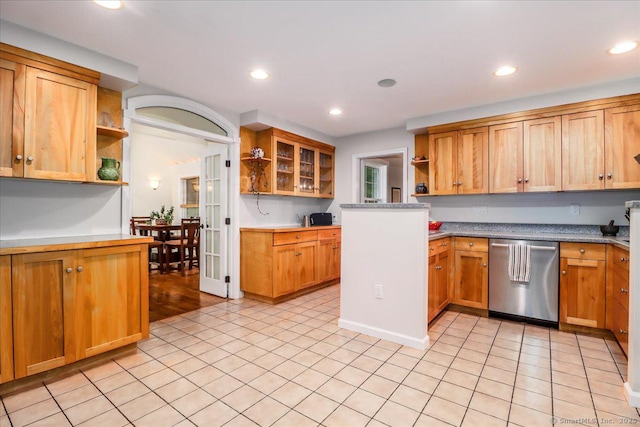 11 Wendover Rd, Newtown, CT 06470 - kitchen with open shelves, stainless steel dishwasher, recessed lighting, light tile patterned floors, and glass insert cabinets