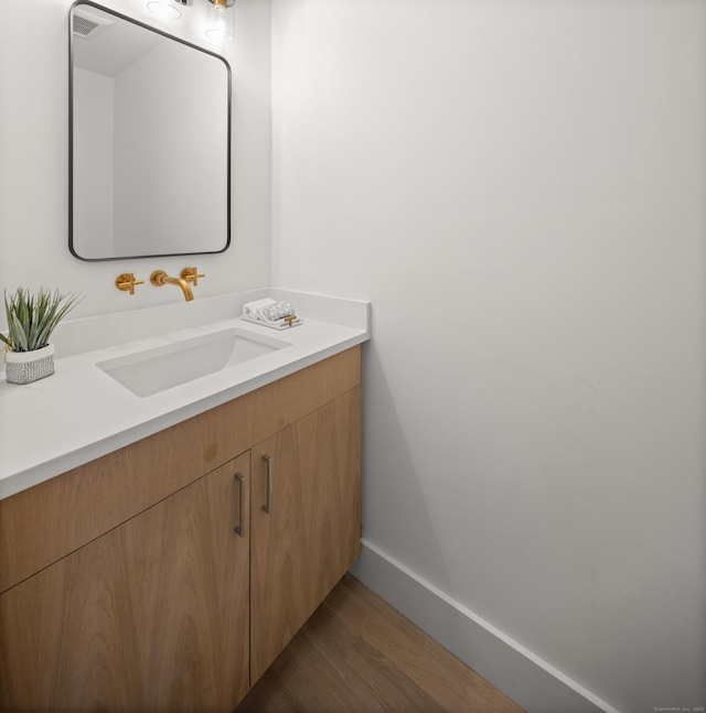 26 Homestead Ln Unit B, Greenwich, CT 06831 - bathroom featuring vanity, wood finished floors, and baseboards