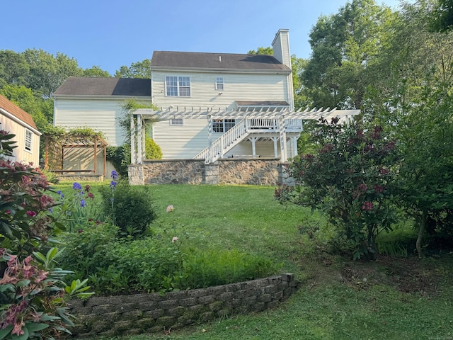29 Swift St, Branford, CT 06405 - rear view of property with a pergola, a chimney, and a lawn