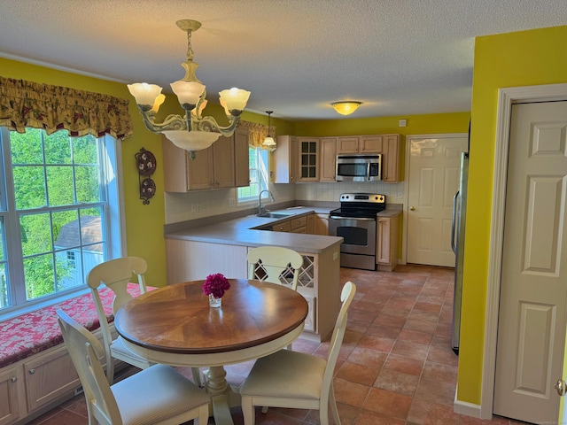 29 Swift St, Branford, CT 06405 - kitchen with appliances with stainless steel finishes, a chandelier, tasteful backsplash, glass insert cabinets, and a textured ceiling
