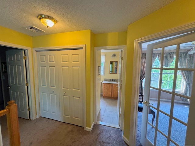 29 Swift St, Branford, CT 06405 - hall featuring a textured ceiling and carpet