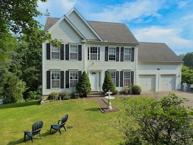 29 Swift St, Branford, CT 06405 - colonial-style house featuring a garage, a front yard, a chimney, driveway, and roof with shingles