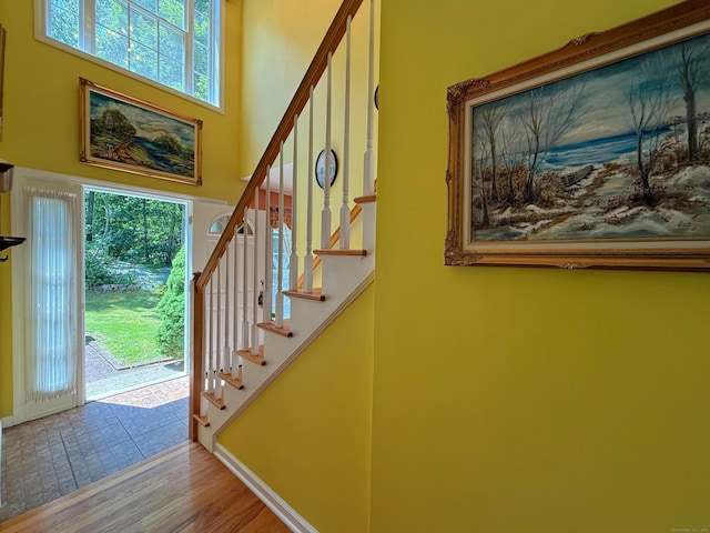 29 Swift St, Branford, CT 06405 - foyer entrance featuring stairs, wood finished floors, and a high ceiling