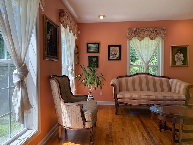 29 Swift St, Branford, CT 06405 - living area featuring healthy amount of natural light and wood finished floors