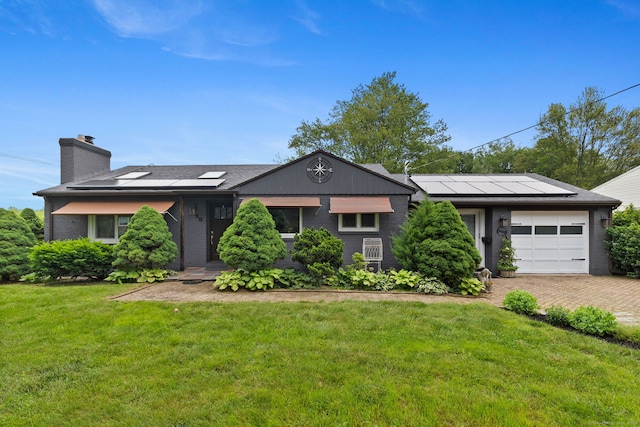 20 Marlin Rd, New Britain, CT 06053 - single story home with an attached garage, a chimney, a front lawn, solar panels, and driveway
