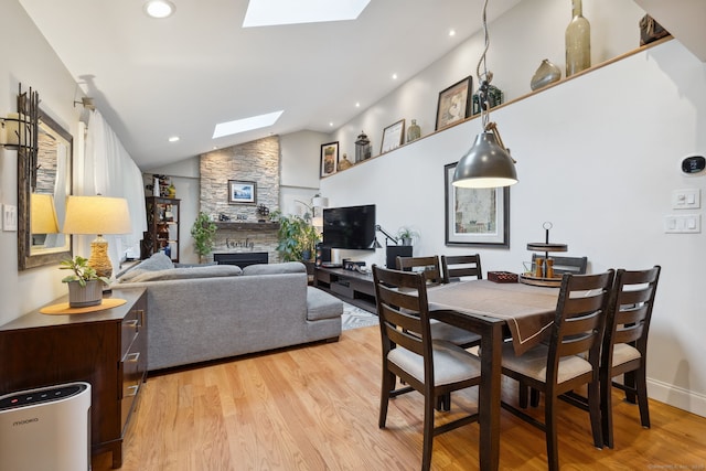 20 Marlin Rd, New Britain, CT 06053 - dining area with a skylight, light wood-style floors, a fireplace, lofted ceiling, and recessed lighting