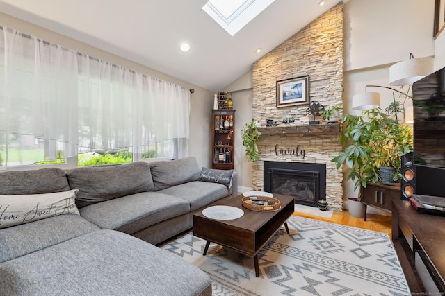 20 Marlin Rd, New Britain, CT 06053 - living room featuring a skylight, a stone fireplace, light wood-type flooring, recessed lighting, and high vaulted ceiling