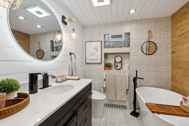 20 Marlin Rd, New Britain, CT 06053 - bathroom with a freestanding tub, vanity, wooden walls, toilet, and tile patterned flooring