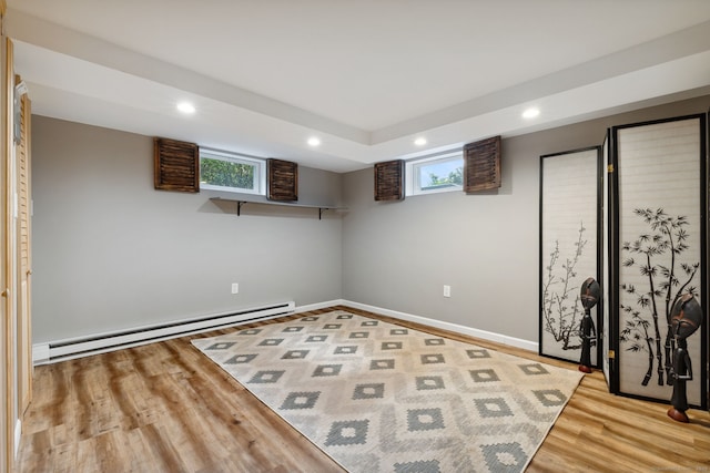 20 Marlin Rd, New Britain, CT 06053 - basement with a baseboard heating unit, wood finished floors, recessed lighting, and plenty of natural light