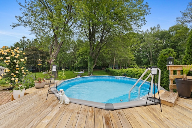 20 Marlin Rd, New Britain, CT 06053 - outdoor pool with a wooden deck, a yard, and view of wooded area