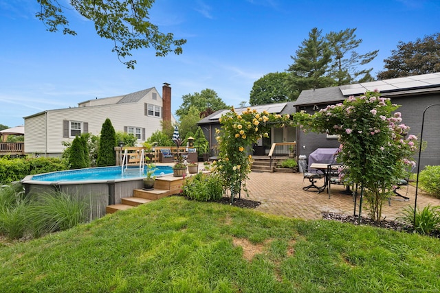 20 Marlin Rd, New Britain, CT 06053 - view of grassy yard with a wooden deck, an outdoor pool, and a patio