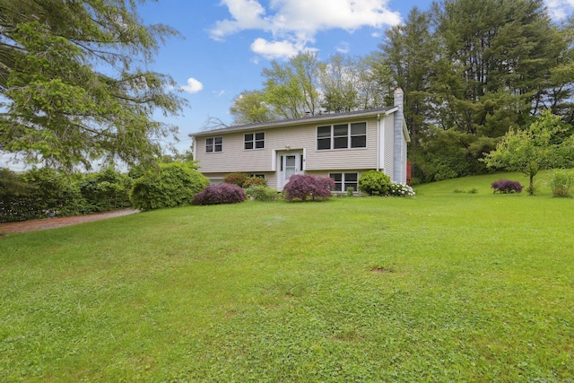 6 Royal Oaks Dr, Ledyard, CT 06339 - split foyer home with a chimney and a front lawn