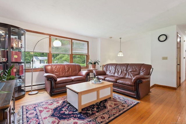 6 Royal Oaks Dr, Ledyard, CT 06339 - living room with light wood-style flooring, a baseboard heating unit, and baseboards