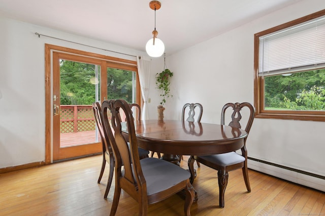 6 Royal Oaks Dr, Ledyard, CT 06339 - dining area with light wood finished floors, baseboard heating, and baseboards
