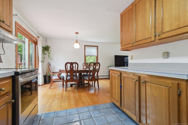 6 Royal Oaks Dr, Ledyard, CT 06339 - kitchen featuring stainless steel electric range, brown cabinetry, and light countertops
