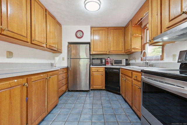 6 Royal Oaks Dr, Ledyard, CT 06339 - kitchen featuring black appliances, light countertops, brown cabinets, and a sink