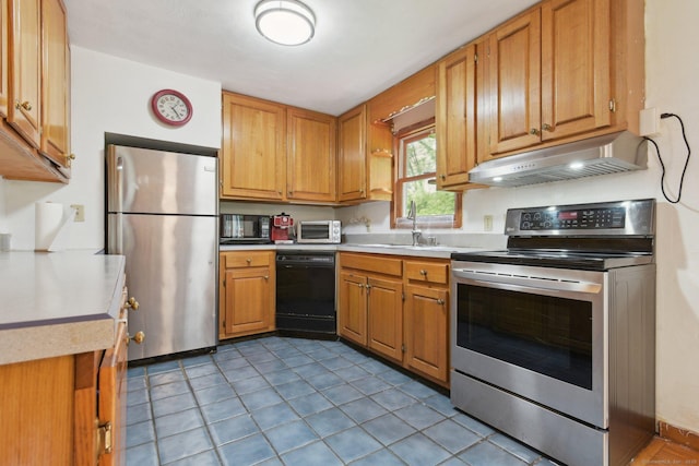 6 Royal Oaks Dr, Ledyard, CT 06339 - kitchen featuring black appliances, under cabinet range hood, light countertops, and a sink