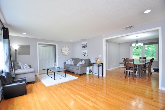59 Settlers Knl, Newington, CT 06111 - living area with light wood finished floors, a chandelier, baseboards, and recessed lighting
