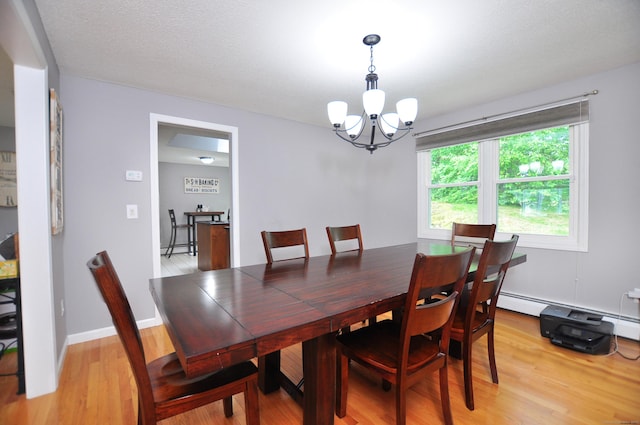 59 Settlers Knl, Newington, CT 06111 - dining area with a chandelier and light wood-style flooring