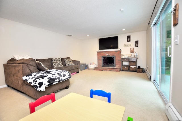 59 Settlers Knl, Newington, CT 06111 - living room featuring a baseboard radiator, carpet, healthy amount of natural light, and recessed lighting