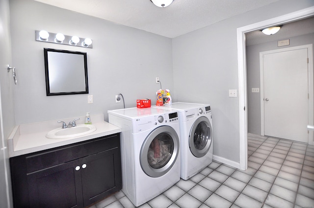 59 Settlers Knl, Newington, CT 06111 - laundry room featuring a sink, washer and dryer, and light tile patterned flooring