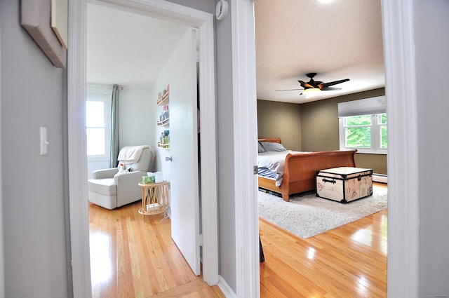 59 Settlers Knl, Newington, CT 06111 - corridor with wood finished floors and a baseboard heating unit