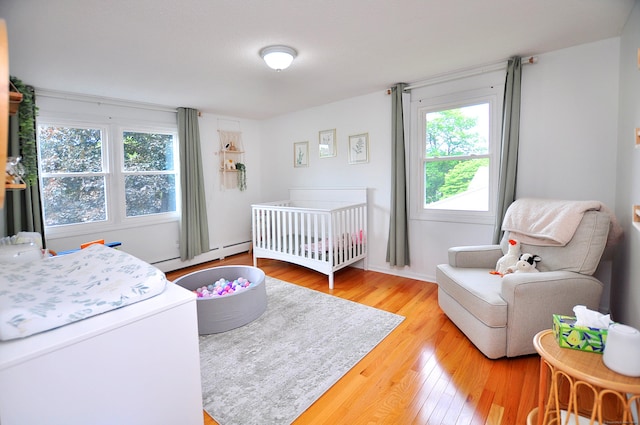 59 Settlers Knl, Newington, CT 06111 - bedroom with wood finished floors and a baseboard radiator