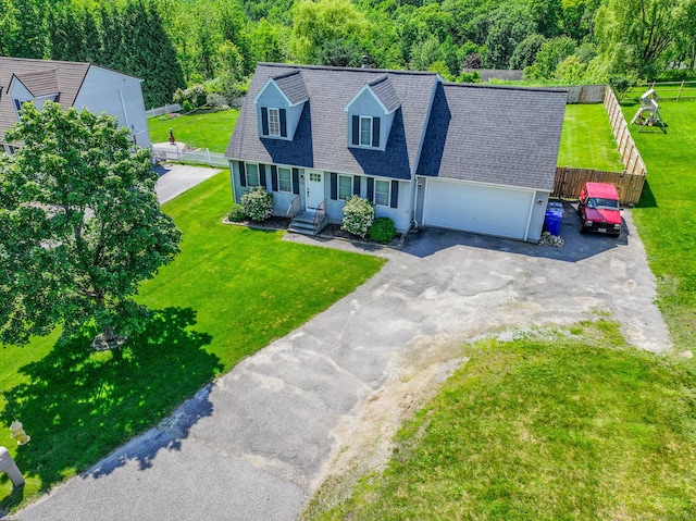 527 Highland Ave, Torrington, CT 06790 - cape cod-style house featuring an attached garage, asphalt driveway, and roof with shingles