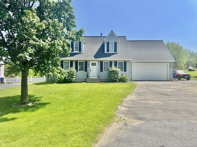 527 Highland Ave, Torrington, CT 06790 - cape cod house featuring asphalt driveway, a garage, a shingled roof, and entry steps