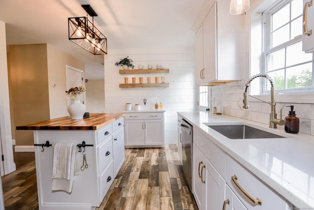 527 Highland Ave, Torrington, CT 06790 - kitchen with a sink, butcher block countertops, stainless steel dishwasher, and wood finished floors