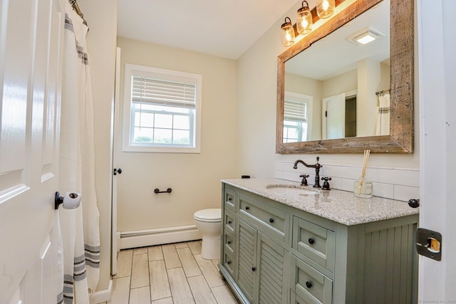 527 Highland Ave, Torrington, CT 06790 - bathroom featuring a baseboard heating unit, vanity, toilet, and baseboards