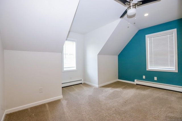 527 Highland Ave, Torrington, CT 06790 - additional living space featuring baseboard heating, vaulted ceiling, ceiling fan, carpet, and baseboards