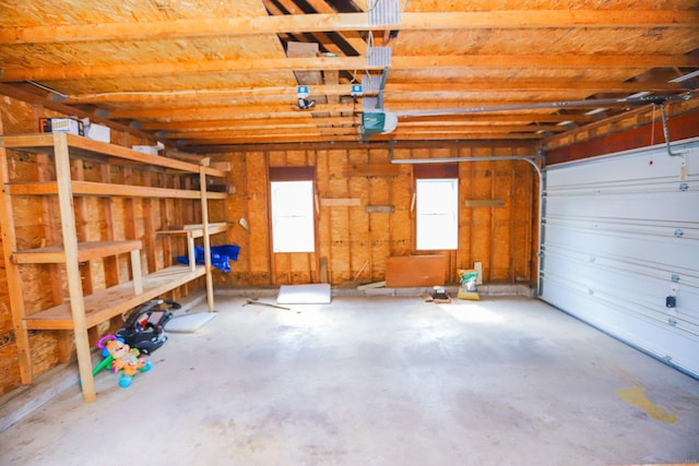 527 Highland Ave, Torrington, CT 06790 - garage featuring a garage door opener