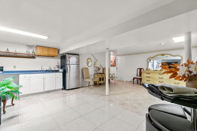30 Hi Barlow Rd, Newtown, CT 06470 - kitchen with freestanding refrigerator, dark countertops, white cabinets, light tile patterned floors, and open shelves