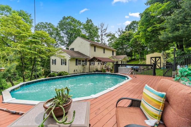 30 Hi Barlow Rd, Newtown, CT 06470 - swimming pool with a storage shed, a deck, and view of scattered trees